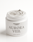 Jar of Aurora Veil cream with visible brand name on a white background