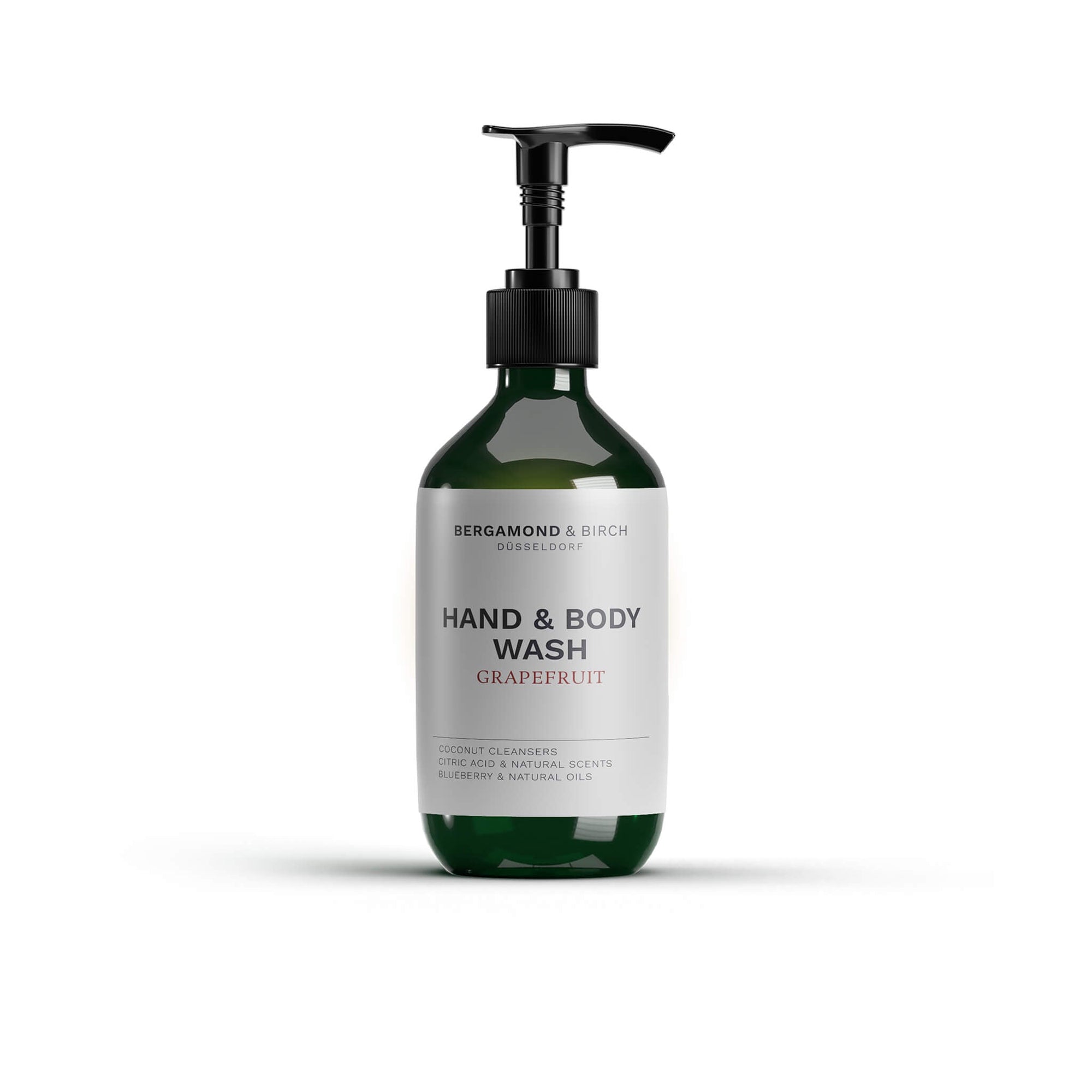 Die Bergamond and Birch Hand and Body Wash Grapefruit steht als grüner Pumpspender mit weißem Etikett vor weißem Hintergrund und präsentiert sich als mildes Reinigungsprodukt für Hände und Körper mit Zitrusduft.
