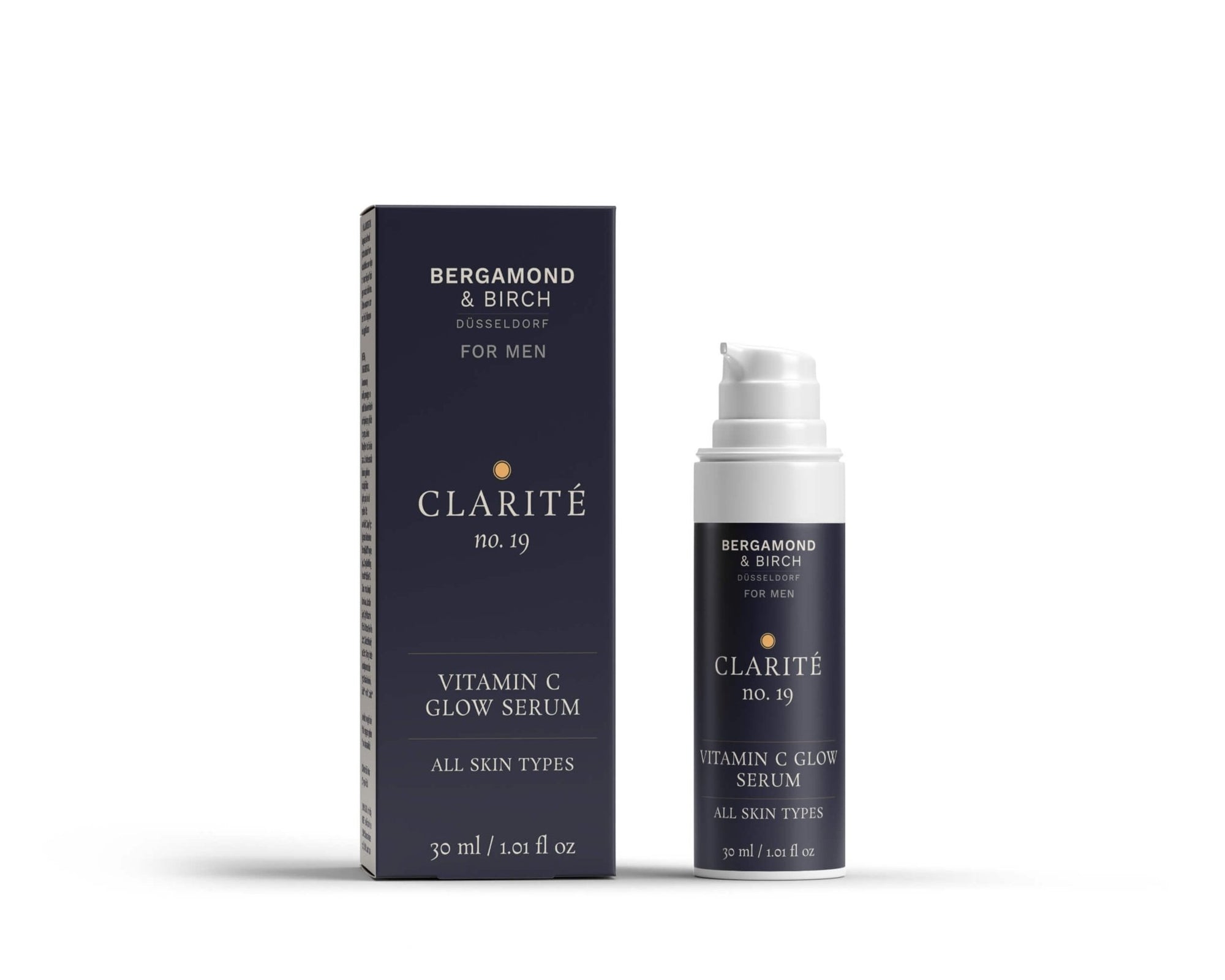 Men’s brightening serum with vitamin C – CLARITÉ No. 19 by Bergamond & Birch, a premium glow-enhancing formula for all skin types, shown in a white pump bottle with elegant navy packaging, 30 ml.