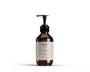 A premium amber-toned bottle of Vitalise No. 51 – Body Serum Spiced Wood from Bergamond & Birch. The sleek pump bottle features a minimalist ivory label and stands against a crisp white backdrop, reflecting an earthy, masculine scent profile. Designed for all skin types and a refined grooming experience.
